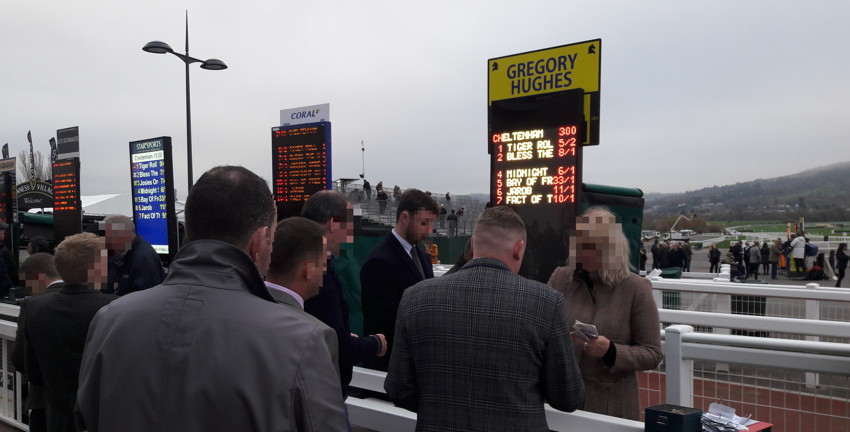 bookies-paying-out-winning-bets-at-cheletnham-racecourse