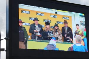 jcb triumph hurdle winners being given prizes