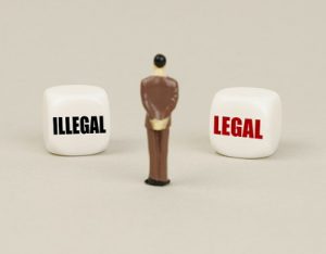 legal illegal blocks toy man standing between
