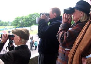stewards monitoring a horse race